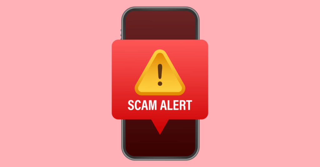A phone with a scam alert