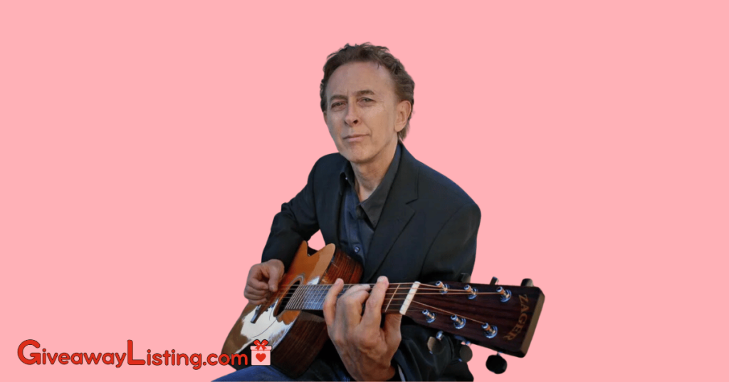 Denny Zager strumming a Zager Guitar