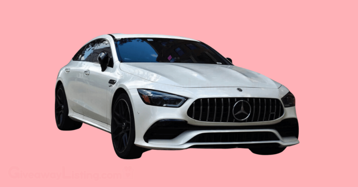 a white car in a pink background.