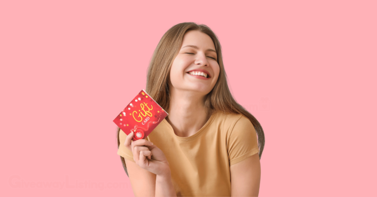 a person happily holding a gift card
