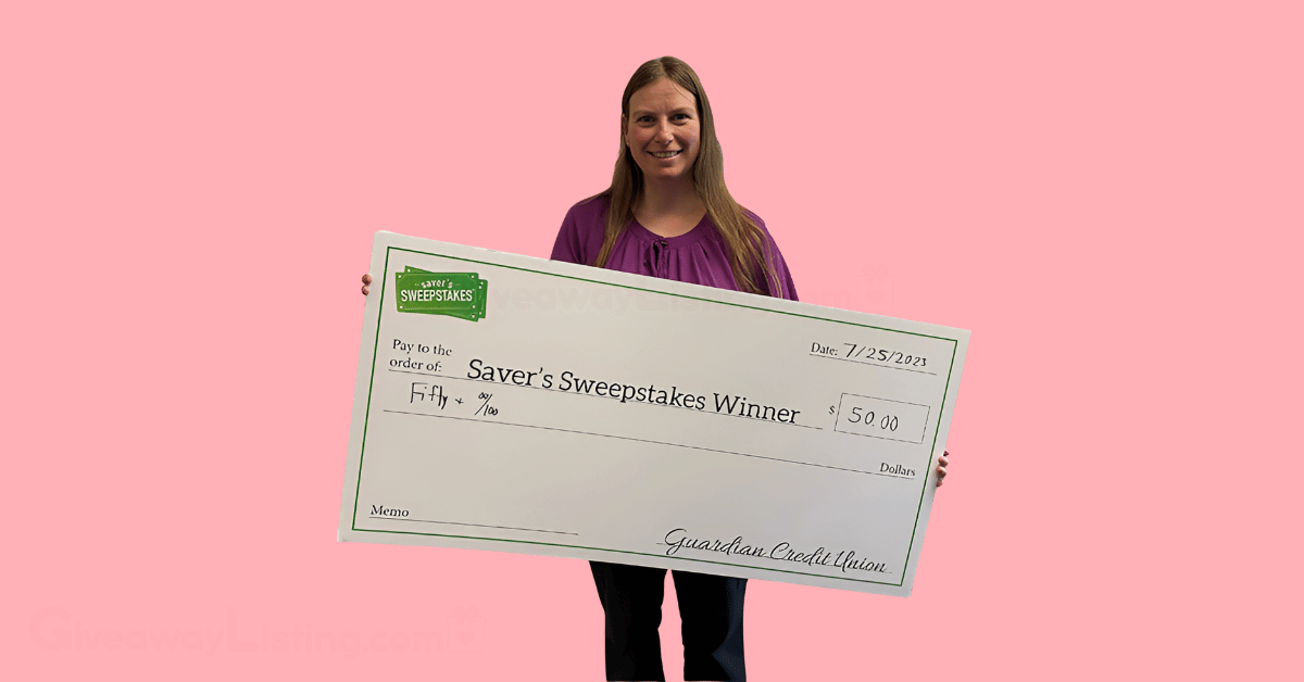 a winner of the Saver sweepstakes, holding her winners cheque.