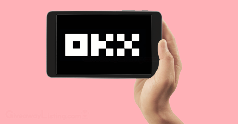 a person's hand holding a mobile tablet displaying the OKX logo on the screen.