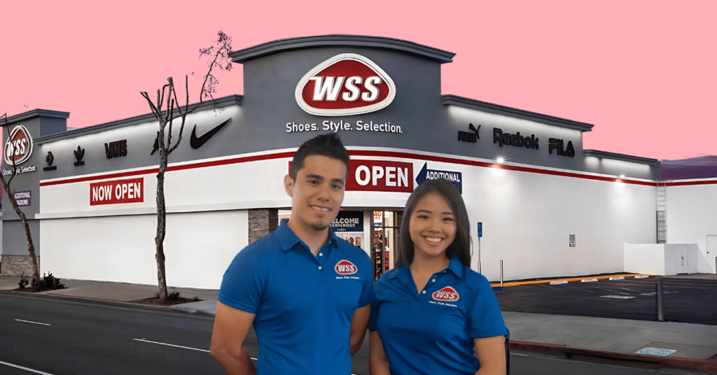 two WSS staff in front of a WSS store.
