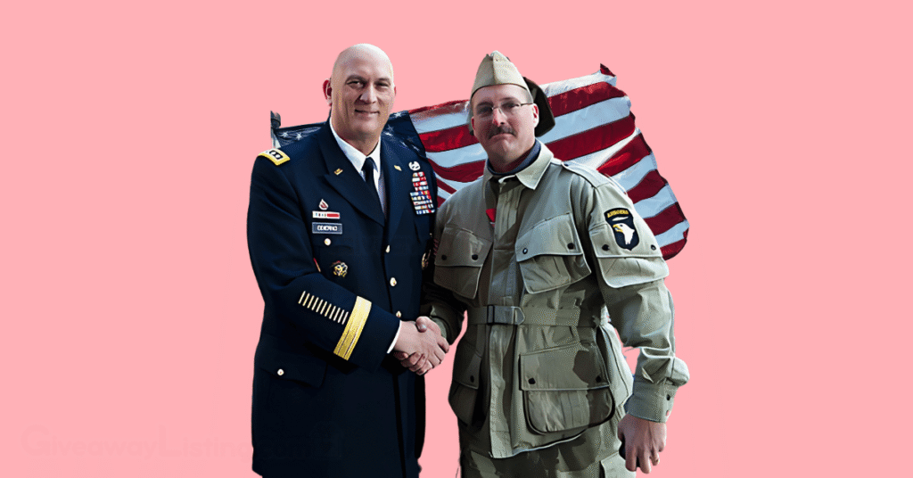 Two Veterans shaking hands with the US national flag behind them.