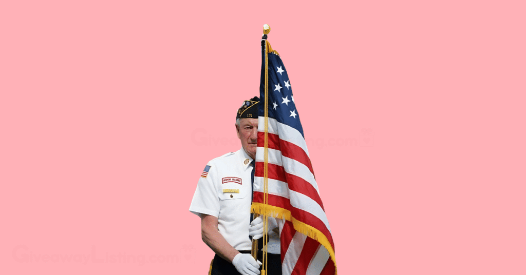 A veteran holding the US national flag.