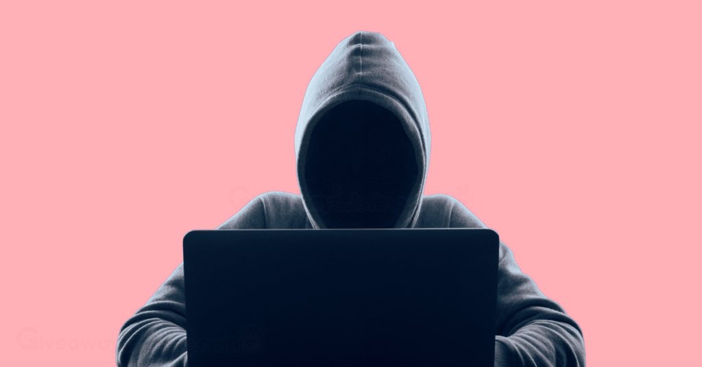 a faceless Crypto hacker with a hoodie and a laptop.