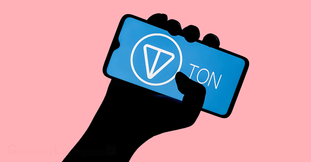 a person's hand holding a phone with the screen showing the TON logo.
