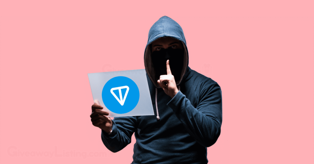 a hacker holding a piece of paper with the Toncoin logo.
