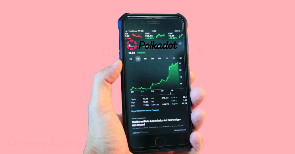 a person's hand holding a phone showing the Polkadot logo on a trading dashboard.