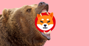 a bear with the Shiba Inu logo between its teeth.